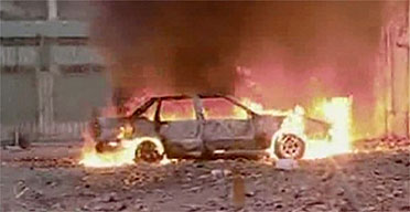 A car burns near the Italian consulate in the north-eastern city of Benghazi, Libya. Photograph: Reuters/Libya